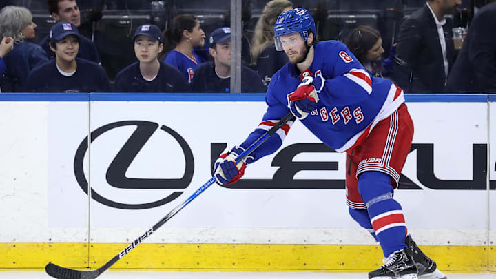 May 22, 2024; New York, New York, USA; New York Rangers defenseman Jacob Trouba (8) controls the puck against the Florida Panthers during the third period of game one of the Eastern Conference Final of the 2024 Stanley Cup Playoffs at Madison Square Garden. Mandatory Credit: Brad Penner-Imagn Images