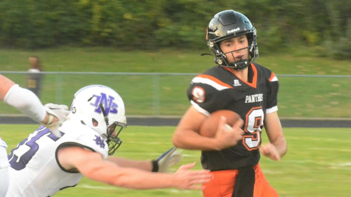 Plainfield junior quarterback Brayden Rizer avoids the tackle against North Branford on Thursday night at Plainfield High School. Plainfield junior quarterback Brayden Rizer avoids the tackle against North Branford on Thursday night at Plainfield High School.