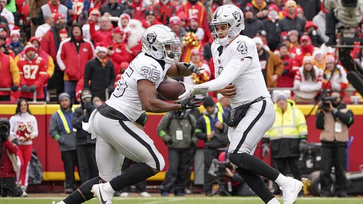 Dec 25, 2023; Kansas City, Missouri, USA; Las Vegas Raiders quarterback Aidan O'Connell (4) hands off to running back Zamir White (35) against the Kansas City Chiefs during the game at GEHA Field at Arrowhead Stadium. Mandatory Credit: Denny Medley-USA TODAY Sports Dec 25, 2023; Kansas City, Missouri, USA; Las Vegas Raiders quarterback Aidan O'Connell (4) hands off to running back Zamir White (35) against the Kansas City Chiefs during the game at GEHA Field at Arrowhead Stadium. Mandatory Credit: Denny Medley-USA TODAY Sports