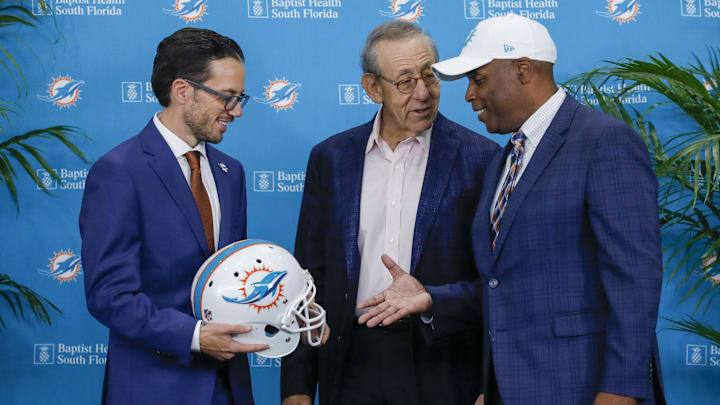 Miami Dolphins head coach Mike McDaniel, shakes hands with general manager Chris Grier and owner Stephen M. Ross after a press conference at Baptist Health Training Center back in February 2022.