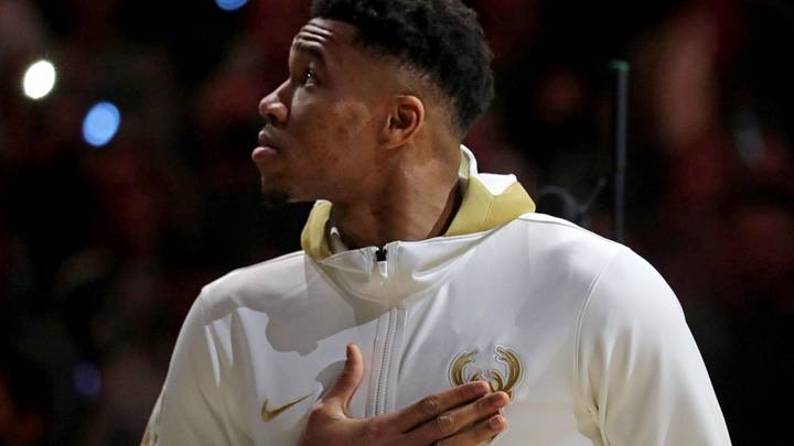Oct. 19, 2021; Milwaukee, WI, USA; Milwaukee Bucks forward Giannis Antetokounmpo (34) watches as the the Milwaukee Bucks' 2021 championship banner is unveiled with his Championship ring during Milwaukee Bucks ring ceremony; Mand atory credit: Mike De Sisti-USA TODAY NETWORK via Imagn Images
Oct. 19, 2021; Milwaukee, WI, USA; Milwaukee Bucks forward Giannis Antetokounmpo (34) watches as the the Milwaukee Bucks' 2021 championship banner is unveiled with his Championship ring during Milwaukee Bucks ring ceremony; Mand atory credit: Mike De Sisti-USA TODAY NETWORK via Imagn Images