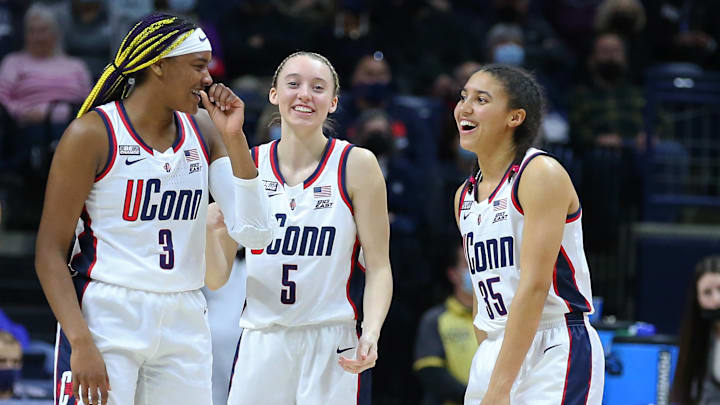UConn Huskies players Aaliyah Edwards (3), Paige Bueckers (5), and Azzi Fudd (35) during a February 27, 2022 game.