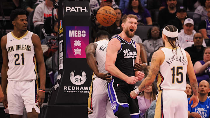 Feb 8, 2025; Sacramento, California, USA; Sacramento Kings center Domantas Sabonis (11) reacts after being fouled by New Orleans Pelicans forward Zion Williamson (1) during the third quarter at Golden 1 Center. Mandatory Credit: Kelley L Cox-Imagn Images