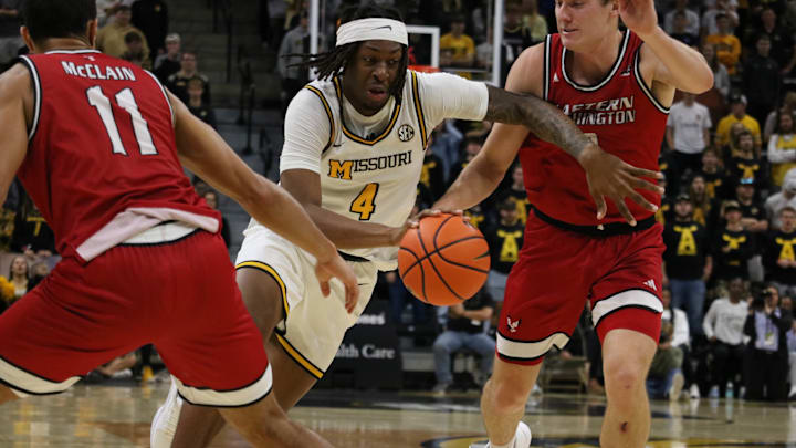 Nov. 11, 2024; Columbia, Missouri, USA; Missouri Tigers forward Marcus Allen (4) drives past defenders during a game against Eastern Washington at Mizzou Arena. Nov. 11, 2024; Columbia, Missouri, USA; Missouri Tigers forward Marcus Allen (4) drives past defenders during a game against Eastern Washington at Mizzou Arena.