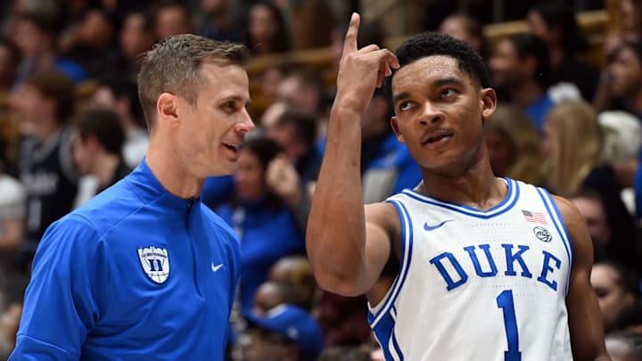 Feb 28, 2026; Durham, North Carolina, USA; Duke Blue Devils guard Caleb Foster (1) gestures to head coach Jon Scheyer during the second half against the Virginia Cavaliers at Cameron Indoor Stadium.   Duke won 77-51.  Mandatory Credit: Rob Kinnan-Imagn Images