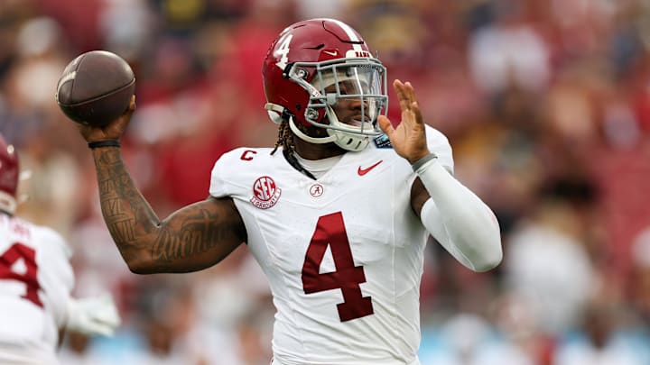 Dec 31, 2024; Tampa, FL, USA; Alabama Crimson Tide quarterback Jalen Milroe (4) drops back to pass against the Michigan Wolverines in the first quarter  during the ReliaQuest Bowl at Raymond James Stadium. Mandatory Credit: Nathan Ray Seebeck-Imagn Images