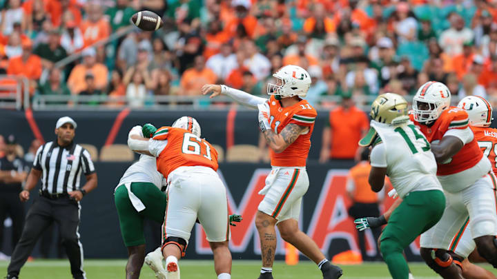 Sep 13, 2025; Miami Gardens, Florida, USA; Miami Hurricanes quarterback Carson Beck (11) passes the football against the South Florida Bulls during the first quarter at Hard Rock Stadium. Mandatory Credit: Sam Navarro-Imagn Images Sep 13, 2025; Miami Gardens, Florida, USA; Miami Hurricanes quarterback Carson Beck (11) passes the football against the South Florida Bulls during the first quarter at Hard Rock Stadium. Mandatory Credit: Sam Navarro-Imagn Images
