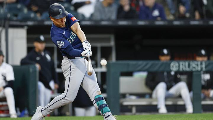 May 9, 2026; Chicago, Illinois, USA; Seattle Mariners right fielder Rob Refsnyder (30) hits an RBI-sacrifice fly against the Chicago White Sox during the fifth inning at Rate Field. Mandatory Credit: Kamil Krzaczynski-Imagn Images