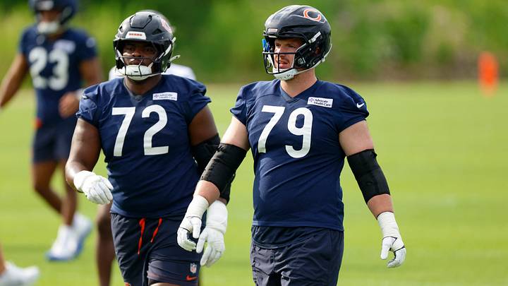 Theo Bendet (79) and Kiran Amegadjie work during the team's pre-practice routine at Halas Hall.