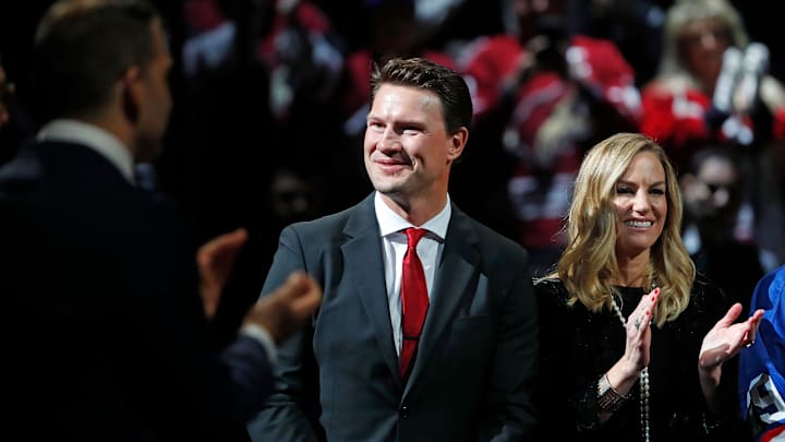 Shane Doan smiles as he receives a standing ovation next to his wife Andrea during his jersey retirement ceremony at Gila River Arena in Glendale, Ariz. on February 24, 2019. 

Z6i5647