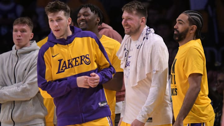 Feb 10, 2025; Los Angeles, California, USA; Los Angeles Lakers guard Dalton Knecht (4), guard Austin Reaves (15) and guard Gabe Vincent (7) on the bench in the second half against the Utah Jazz at Crypto.com Arena. Mandatory Credit: Jayne Kamin-Oncea-Imagn Images