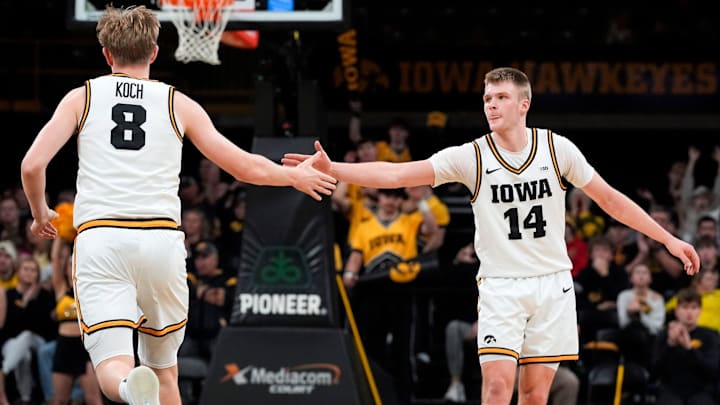 Iowa Hawkeyes forward Cooper Koch (8) and guard Bennett Stirtz (14)