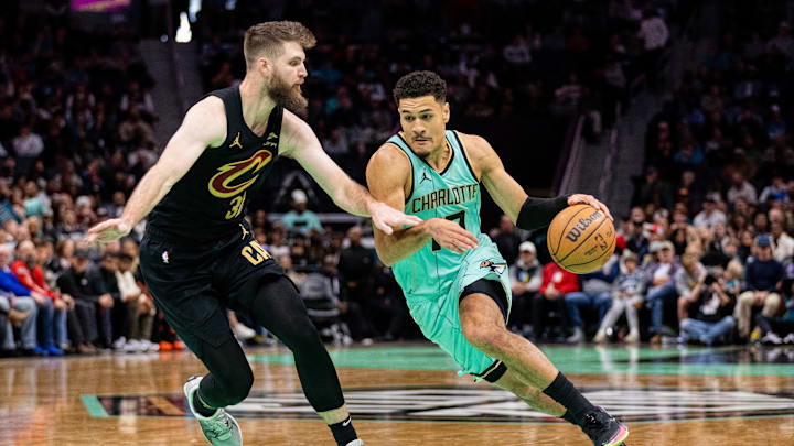 Charlotte Hornets guard Josh Green (10) drives on Cleveland Cavaliers forward Dean Wade