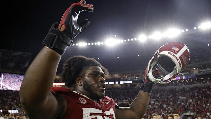 Nov 4, 2023; Tuscaloosa, Alabama, USA; Alabama Crimson Tide offensive lineman Tyler Booker (52) celebrates after defeating the LSU Tigers during the second half at Bryant-Denny Stadium. Mandatory Credit: Butch Dill-Imagn Images