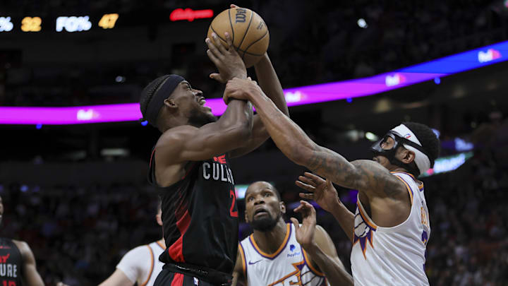 Jan 29, 2024; Miami, Florida, USA; Miami Heat forward Jimmy Butler (22) is fouled by Phoenix Suns guard Bradley Beal (3) during the fourth quarter at Kaseya Center. Mandatory Credit: Sam Navarro-Imagn Images
