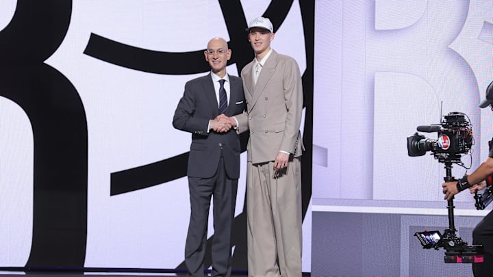 Jun 25, 2025; Brooklyn, NY, USA;  Egor Demin stands with NBA commissioner Adam Silver after being selected as the eighth pick by the Brooklyn Nets in the first round of the 2025 NBA Draft at Barclays Center. Mandatory Credit: Brad Penner-Imagn Images