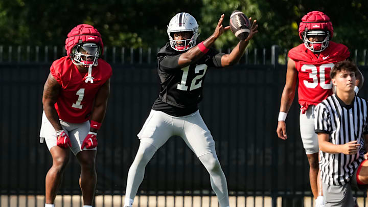 Aug 1, 2024; Columbus, OH, USA; Ohio State Buckeyes quarterback Air Noland (12) takes a snap during football camp at the Woody Hayes Athletic Complex.