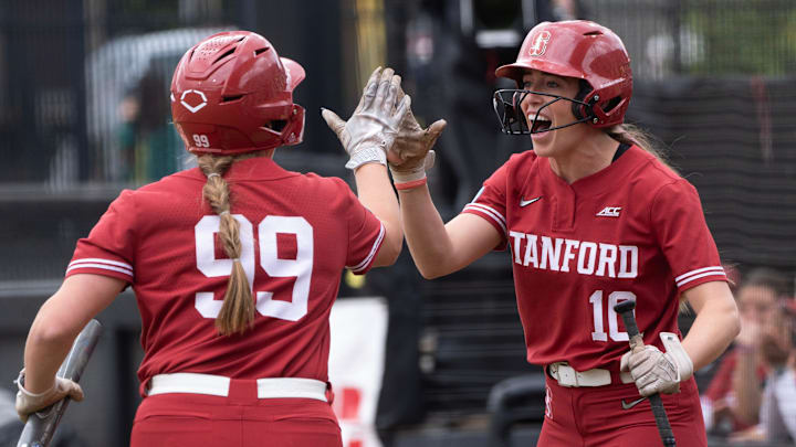 Stanford’s Taryn Kern, left, celebrates the first score of the fame with teammate 	Jade Berry during first inning of the Eugene NCAA Softball Regional May 17, 2025.