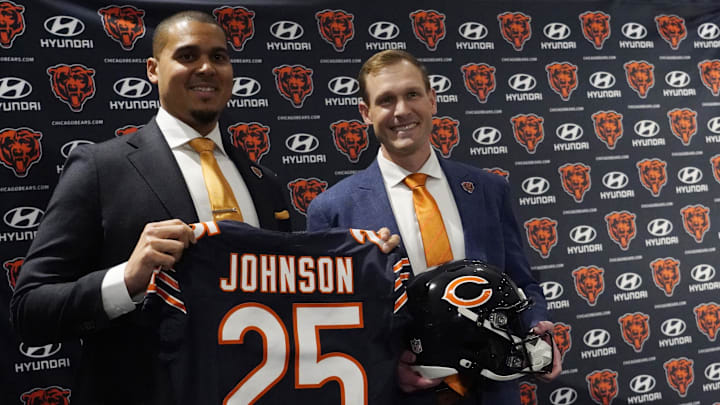 Bears new head coach Ben Johnson (right) with general manager Ryan Poles pose for photos