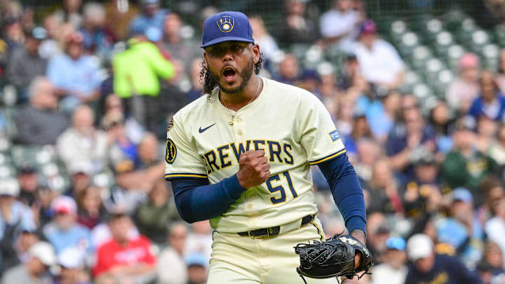 Sep 4, 2025; Milwaukee, Wisconsin, USA;  Milwaukee Brewers starting pitcher Freddy Peralta (51) reacts after striking out Philadelphia Phillies third baseman Alec Bohm (not pictured) with the bases loaded in the fourth inning at American Family Field. Mandatory Credit: Benny Sieu-Imagn Images