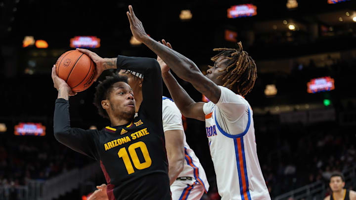 Dec 14, 2024; Atlanta, Georgia, USA; Florida Gators guard Denzel Aberdeen (11) plays defense against Arizona State Sun Devils guard BJ Freeman (10) during the second half at State Farm Arena. Mandatory Credit: Jordan Godfree-Imagn Images