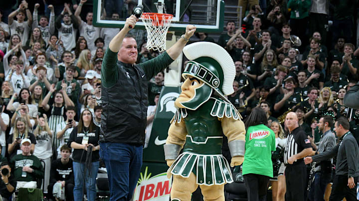 Dec 2, 2025; East Lansing, Michigan, USA;  Michigan State head football coach Pat Fitzgerald watches the Spartans defeat the Iowa Hawkeyes at Jack Breslin Student Events Center. Mandatory Credit: Dale Young-Imagn Images