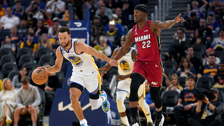 Oct 27, 2022; San Francisco, California, USA; Golden State Warriors guard Stephen Curry (30) dribbles past Miami Heat forward Jimmy Butler (22) in the third quarter at the Chase Center. Mandatory Credit: Cary Edmondson-Imagn Images