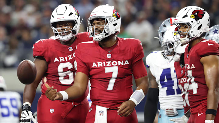 Arizona Cardinals quarterback Jacoby Brissett celebrates scoring a touchdown against the Dallas Cowboys.
