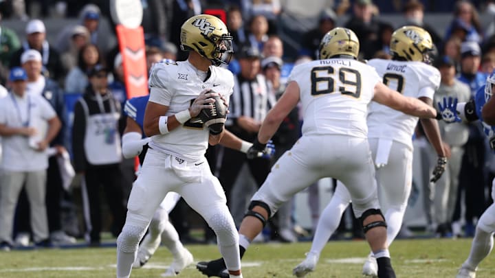Nov 29, 2025; Provo, Utah, USA; UCF Knights quarterback Tayven Jackson (2) looks to pass against the BYU Cougars during the second quarter at LaVell Edwards Stadium. Mandatory Credit: Rob Gray-Imagn Images