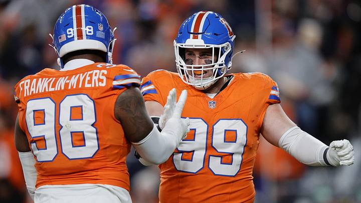 Nov 6, 2025; Denver, Colorado, USA; Denver Broncos defensive end Zach Allen (99) reacts with defensive end John Franklin-Myers (98) during the first half at Empower Field at Mile High. Nov 6, 2025; Denver, Colorado, USA; Denver Broncos defensive end Zach Allen (99) reacts with defensive end John Franklin-Myers (98) during the first half at Empower Field at Mile High.