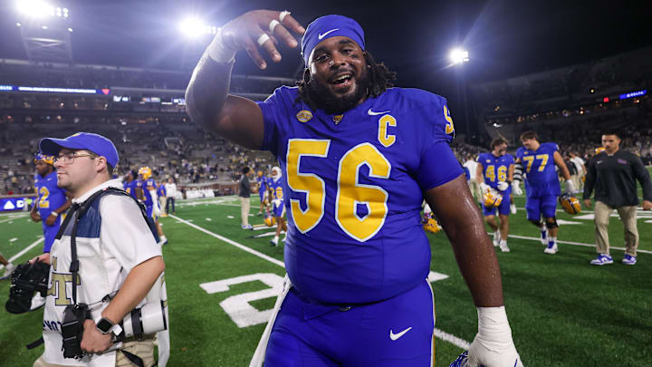 Nov 22, 2025; Atlanta, Georgia, USA; Pittsburgh Panthers offensive lineman Lyndon Cooper (56) celebrates after a victory over the Georgia Tech Yellow Jackets at Bobby Dodd Stadium at Hyundai Field. Mandatory Credit: Brett Davis-Imagn Images Nov 22, 2025; Atlanta, Georgia, USA; Pittsburgh Panthers offensive lineman Lyndon Cooper (56) celebrates after a victory over the Georgia Tech Yellow Jackets at Bobby Dodd Stadium at Hyundai Field. Mandatory Credit: Brett Davis-Imagn Images