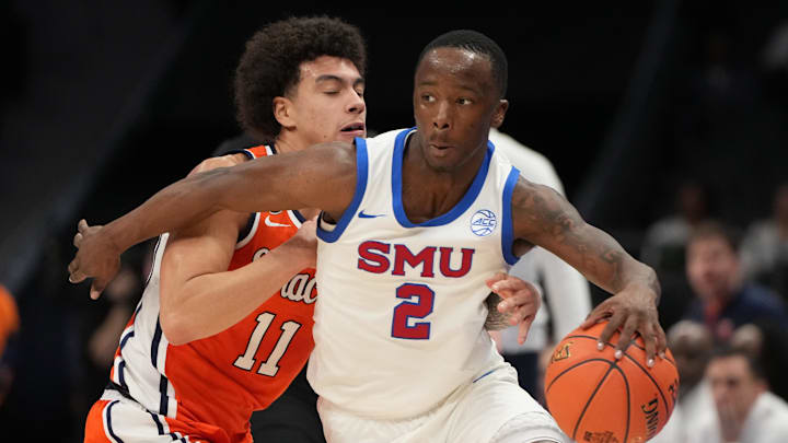 Mar 10, 2026; Charlotte, NC, USA; Southern Methodist University Mustangs guard Boopie Miller (2) with the ball as Syracuse Orange guard Naithan George (11) defends in the second half at Spectrum Center. Mandatory Credit: Bob Donnan-Imagn Images