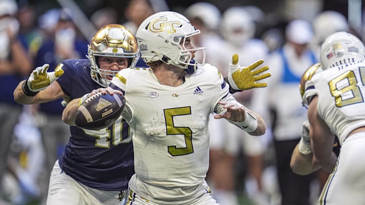 Oct 19, 2024; Atlanta, Georgia, USA; Georgia Tech Yellow Jackets quarterback Zach Pyron (5) is hit while throwing by Notre Dame Fighting Irish defensive end Joshua Burnham (40) at Mercedes-Benz Stadium. Mandatory Credit: Dale Zanine-Imagn Images Oct 19, 2024; Atlanta, Georgia, USA; Georgia Tech Yellow Jackets quarterback Zach Pyron (5) is hit while throwing by Notre Dame Fighting Irish defensive end Joshua Burnham (40) at Mercedes-Benz Stadium. Mandatory Credit: Dale Zanine-Imagn Images