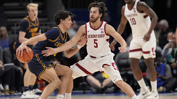 Mar 12, 2025; Charlotte, NC, USA; California Golden Bears guard Andrej Stojakovic (2) handles the ball against Stanford Cardinal guard Benny Gealer (5) during the second half at Spectrum Center. Mandatory Credit: Jim Dedmon-Imagn Images