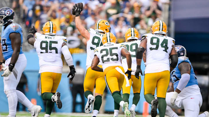 Sep 22, 2024; Nashville, Tennessee, USA;  Green Bay Packers defensive end Lukas Van Ness (90) celebrates the fumble recovery with his teammates against the Tennessee Titans during the first half at Nissan Stadium. Mandatory Credit: Steve Roberts-Imagn Images