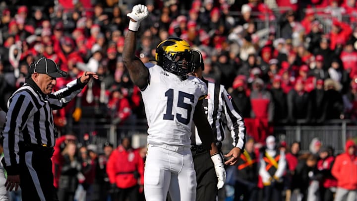 Michigan Wolverines linebacker Ernest Hausmann (15) celebrates after tackling Ohio State Buckeyes quarterback Will Howard (18) during the first half of Saturday’s NCAA Division I football game at Ohio Stadium.