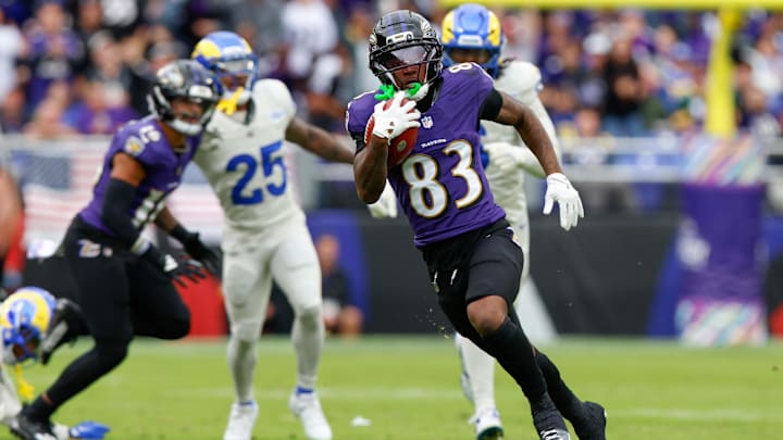 Oct 12, 2025; Baltimore, Maryland, USA; Baltimore Ravens wide receiver Lajohntay Wester (83) carries the ball against the Los Angeles Rams during the second quarter of the game at M&T Bank Stadium. Mandatory Credit: Peter Casey-Imagn Images