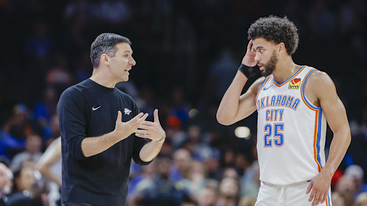 Oct 9, 2024; Oklahoma City, Oklahoma, USA; Oklahoma City Thunder head coach Mark Daigneault talks to guard Ajay Mitchell (25) during a break in play in the second half at Paycom Center. Mandatory Credit: Alonzo Adams-Imagn Images Oct 9, 2024; Oklahoma City, Oklahoma, USA; Oklahoma City Thunder head coach Mark Daigneault talks to guard Ajay Mitchell (25) during a break in play in the second half at Paycom Center. Mandatory Credit: Alonzo Adams-Imagn Images
