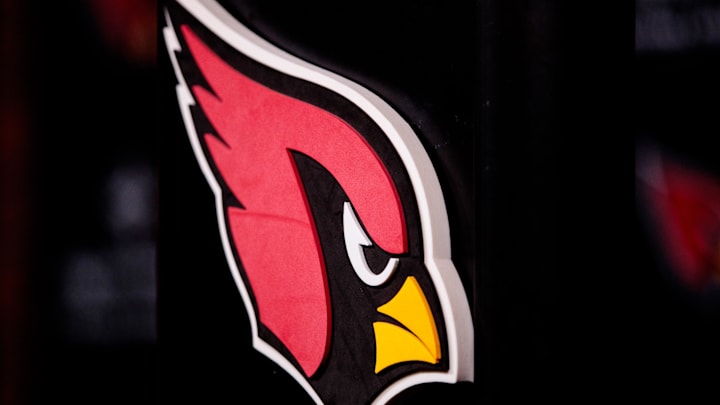 Apr 26, 2019; Tempe, AZ, USA; Detailed view of an Arizona Cardinals logo during a press conference at the Cardinals Training Facility. Mandatory Credit: Mark J. Rebilas-Imagn Images Apr 26, 2019; Tempe, AZ, USA; Detailed view of an Arizona Cardinals logo during a press conference at the Cardinals Training Facility. Mandatory Credit: Mark J. Rebilas-Imagn Images
