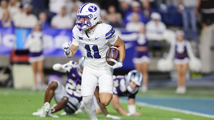 Sep 21, 2024; Provo, Utah, USA; Brigham Young Cougars wide receiver Parker Kingston (11) returns a punt for a touchdown against the Kansas State Wildcats during the third quarter at LaVell Edwards Stadium.