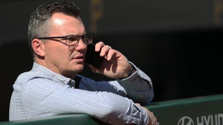 Apr 30, 2025; Pittsburgh, Pennsylvania, USA; Pittsburgh Pirates general manager Ben Cerington looks on over the dugout rail as batting practice takes place before the game  against the Chicago Cubs at PNC Park. Mandatory Credit: Charles LeClaire-Imagn Images