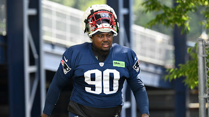 Jul 30, 2022; Foxborough, MA, USA; New England Patriots defensive end Christian Barmore (90) walks to the practice field at the Patriots training camp at Gillette Stadium. Mandatory Credit: Eric Canha-Imagn Images Jul 30, 2022; Foxborough, MA, USA; New England Patriots defensive end Christian Barmore (90) walks to the practice field at the Patriots training camp at Gillette Stadium. Mandatory Credit: Eric Canha-Imagn Images