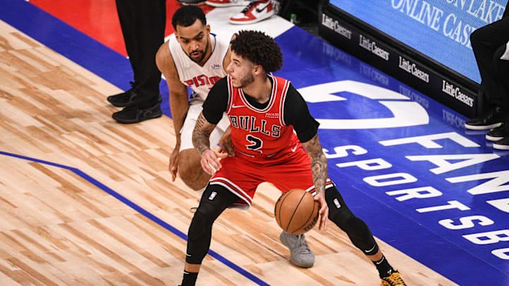 Oct 20, 2021; Detroit, Michigan, USA; Chicago Bulls guard Lonzo Ball (2) as Detroit Pistons forward Trey Lyles (8) defends during the third quarter at Little Caesars Arena. Mandatory Credit: Tim Fuller-Imagn Images