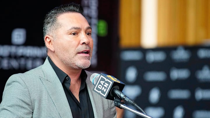 Jan. 25, 2024; Phoenix, Ariz; USA; Oscar De La Hoya speaks about boxer Jamie Munguia (center) about the Munguia v Ryder main event during a press conference for Golden Boy boxing event.