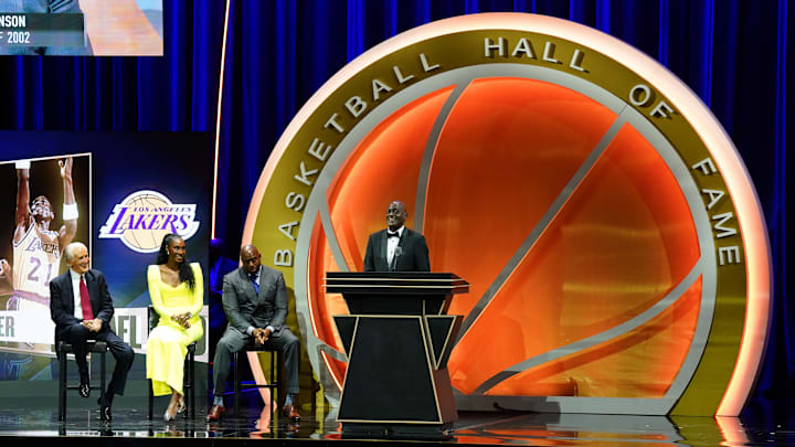 Oct 13, 2024; Uncasville, Conn, USA; Class of 2024 inductee Michael Cooper speaks alongside presenters Magic Johnson (‘02), Pat Riley (‘08) and Lisa Leslie (‘15) during the Naismith Memorial Basketball Hall of Fame Enshrinement at Symphony Hall Springfield. Mandatory Credit: David Butler II-Imagn Images Oct 13, 2024; Uncasville, Conn, USA; Class of 2024 inductee Michael Cooper speaks alongside presenters Magic Johnson (‘02), Pat Riley (‘08) and Lisa Leslie (‘15) during the Naismith Memorial Basketball Hall of Fame Enshrinement at Symphony Hall Springfield. Mandatory Credit: David Butler II-Imagn Images