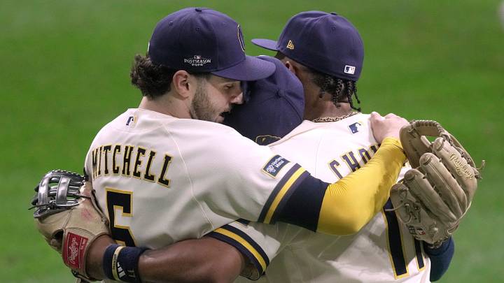 Milwaukee Brewers center fielder Garrett Mitchell (5), right fielder Luis Lara (18) and left fielder Jackson Chourio (11) hug after their National League Division Series game against the San Diego Padres Saturday, October 3, 2026 at American Family Field in Milwaukee, Wisconsin.