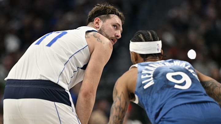 Jan 7, 2024; Dallas, Texas, USA; Dallas Mavericks guard Luka Doncic (77) looks to move the ball past