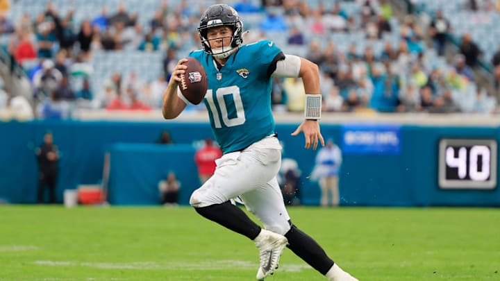 Jacksonville Jaguars quarterback Mac Jones (10) rushes for yards during the fourth quarter Sunday, Dec. 29, 2024 at EverBank Stadium in Jacksonville, Fla. The Jaguars held off the Titans 20-13. [Corey Perrine/Florida Times-Union]