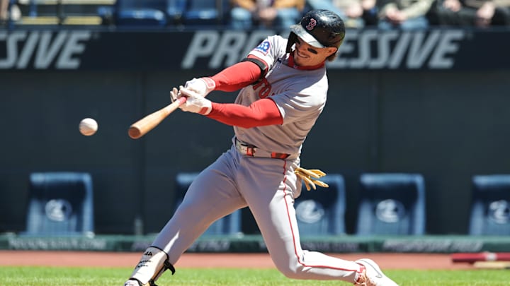 Apr 27, 2025; Cleveland, Ohio, USA; Boston Red Sox left fielder Jarren Duran (16) hits a single during the second inning against the Cleveland Guardians at Progressive Field. Mandatory Credit: Ken Blaze-Imagn Images