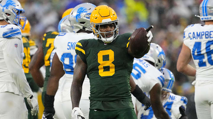 Nov 3, 2024; Green Bay, Wisconsin, USA;  Green Bay Packers running back Josh Jacobs (8) gestures after earning a first down during the first quarter against the Detroit Lions at Lambeau Field. Mandatory Credit: Jeff Hanisch-Imagn Images